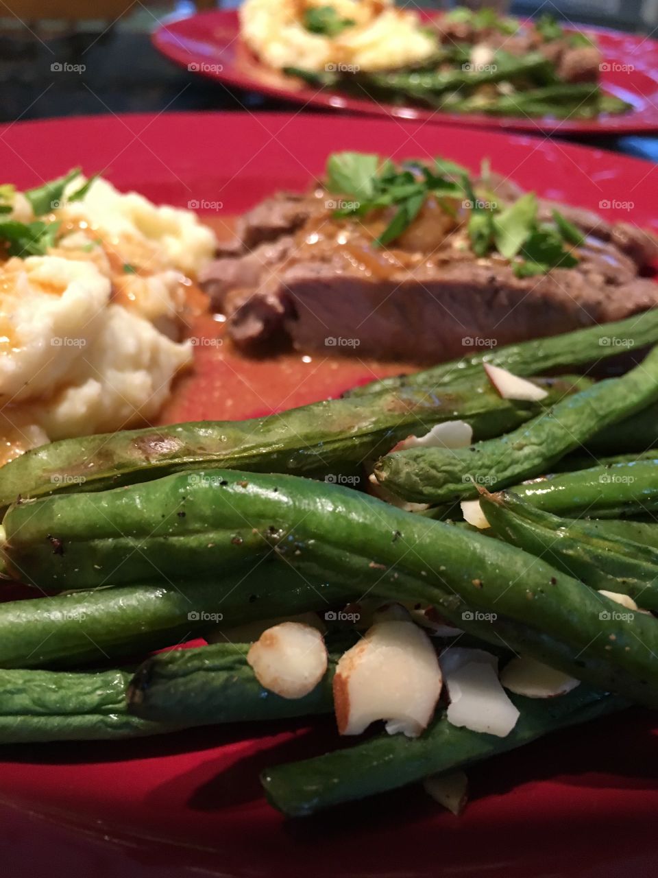 Ribeye steak, truffled potatoes, green beans and almonds 