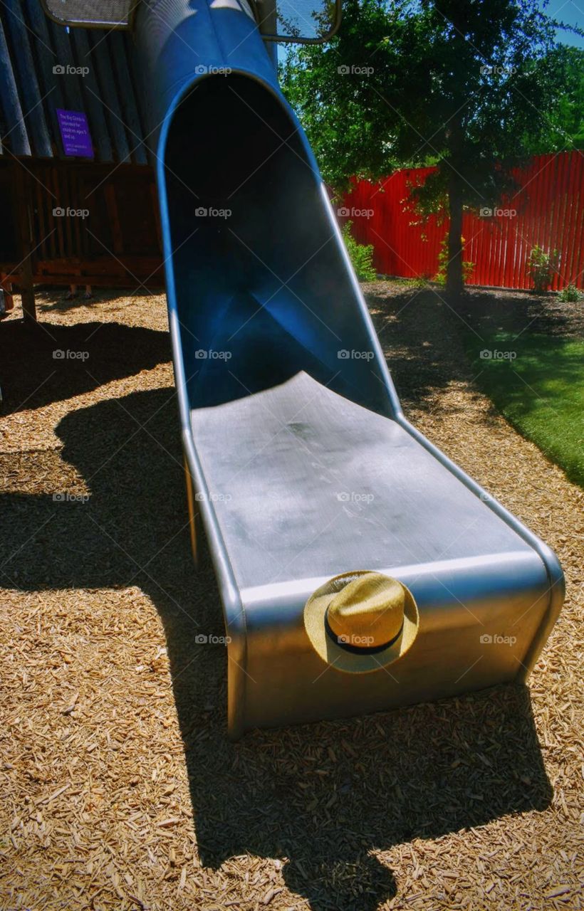 When the hat comes down the slide before the child, yoi just know they are getting ready to really slide down faster and maybe a trailing scream behind them.