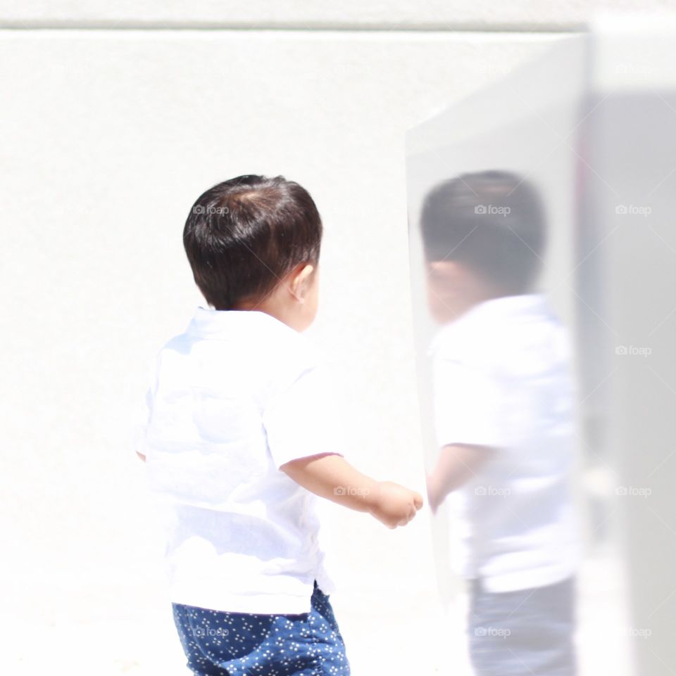 reflection of a running boy