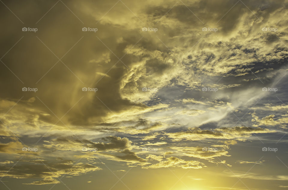 The beauty of the sky with clouds and the sun.