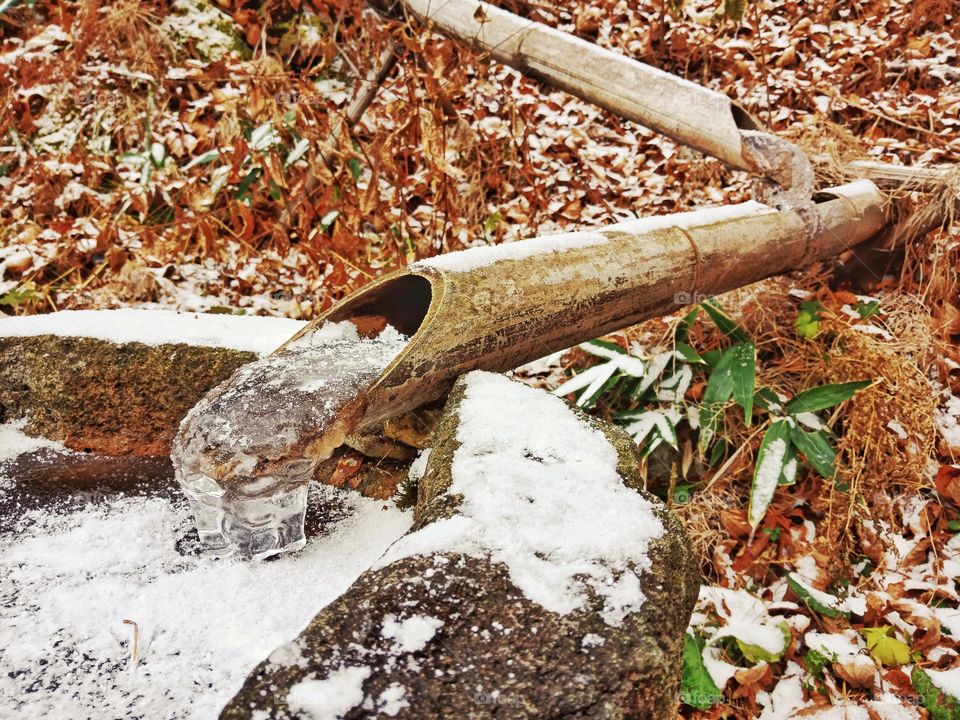 frozen water in winter at Kusatsu onsen, Japan