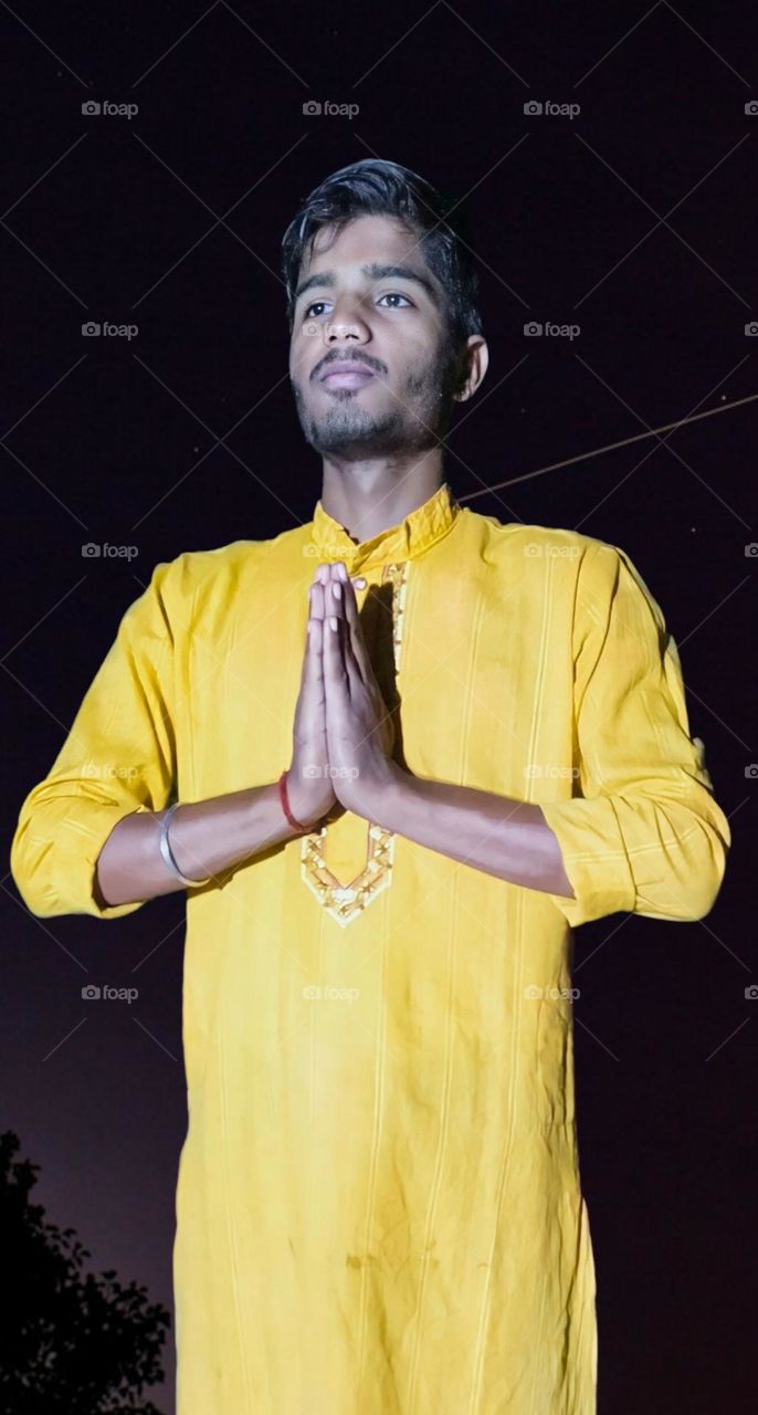 a portrait of Indian boy namskar position