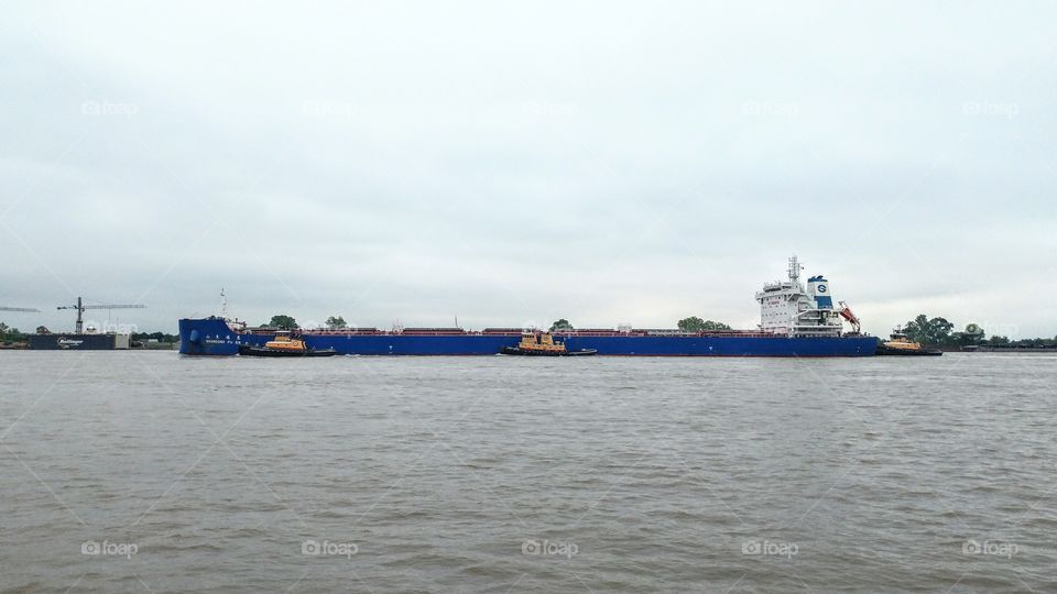 sea going ship coming into New Orleans on the Mississippi River