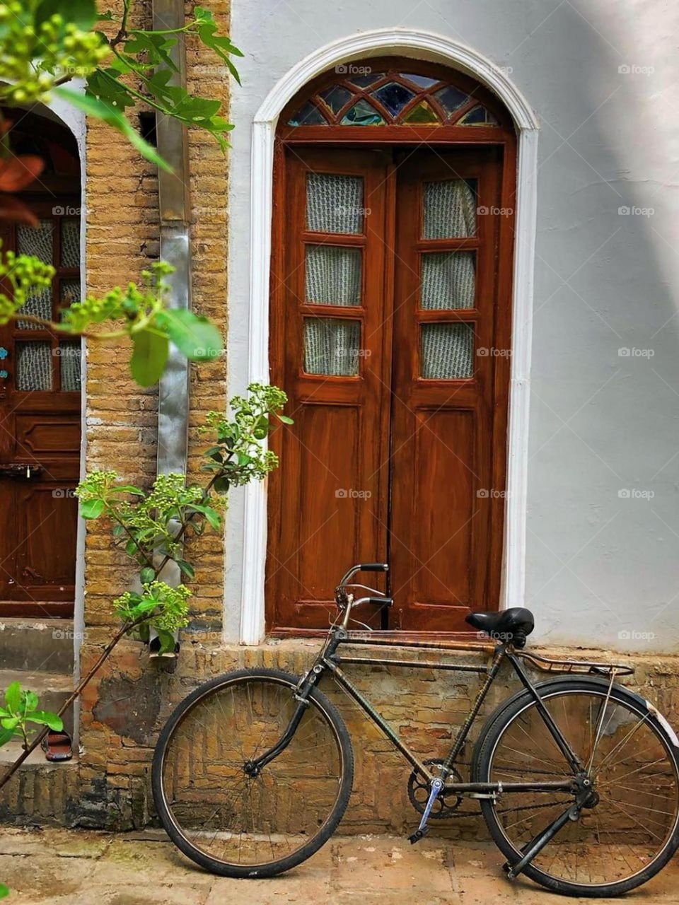 An old lonely bicycle in an old house