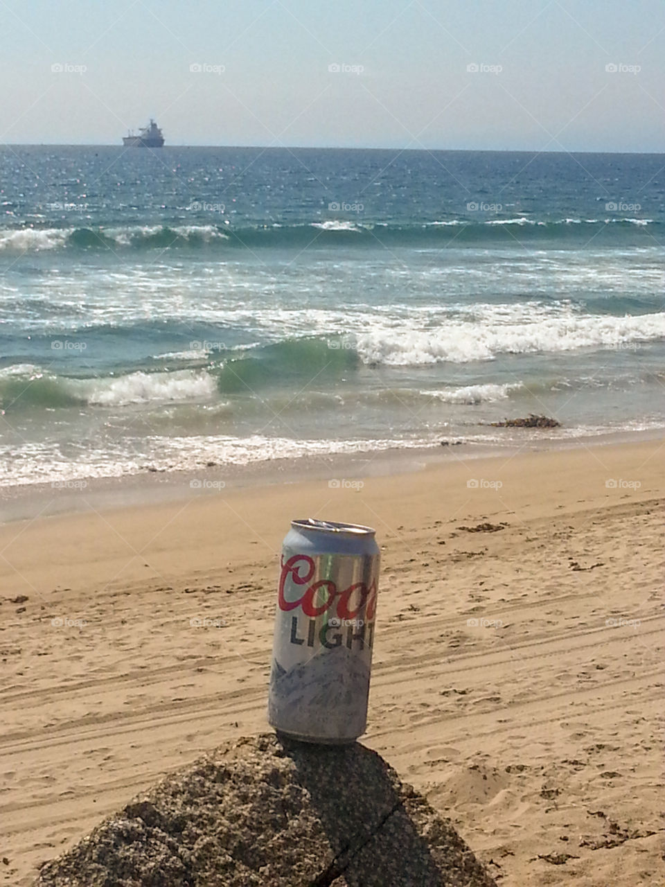 Sunny afternoon on Manhattan Beach, California while drinking a cold Coors Light.