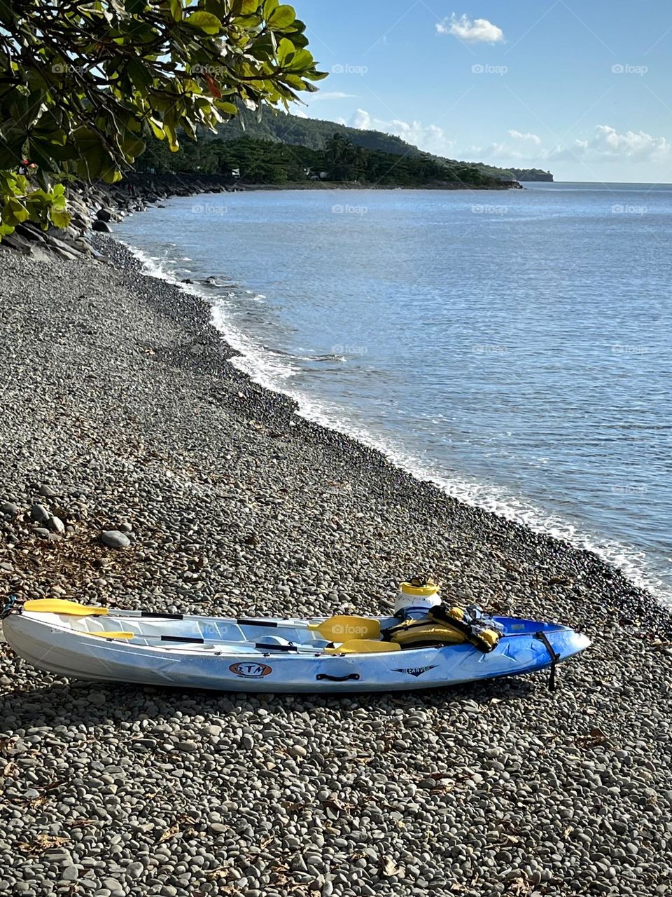 View of kayaks placed on the sand of the beach