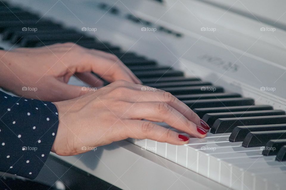 Lovely gentle hands play the piano