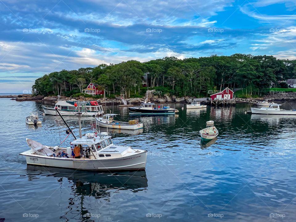 “Home Sweet Harbor”.  A lobster boat returns to harbor at the end of the day.