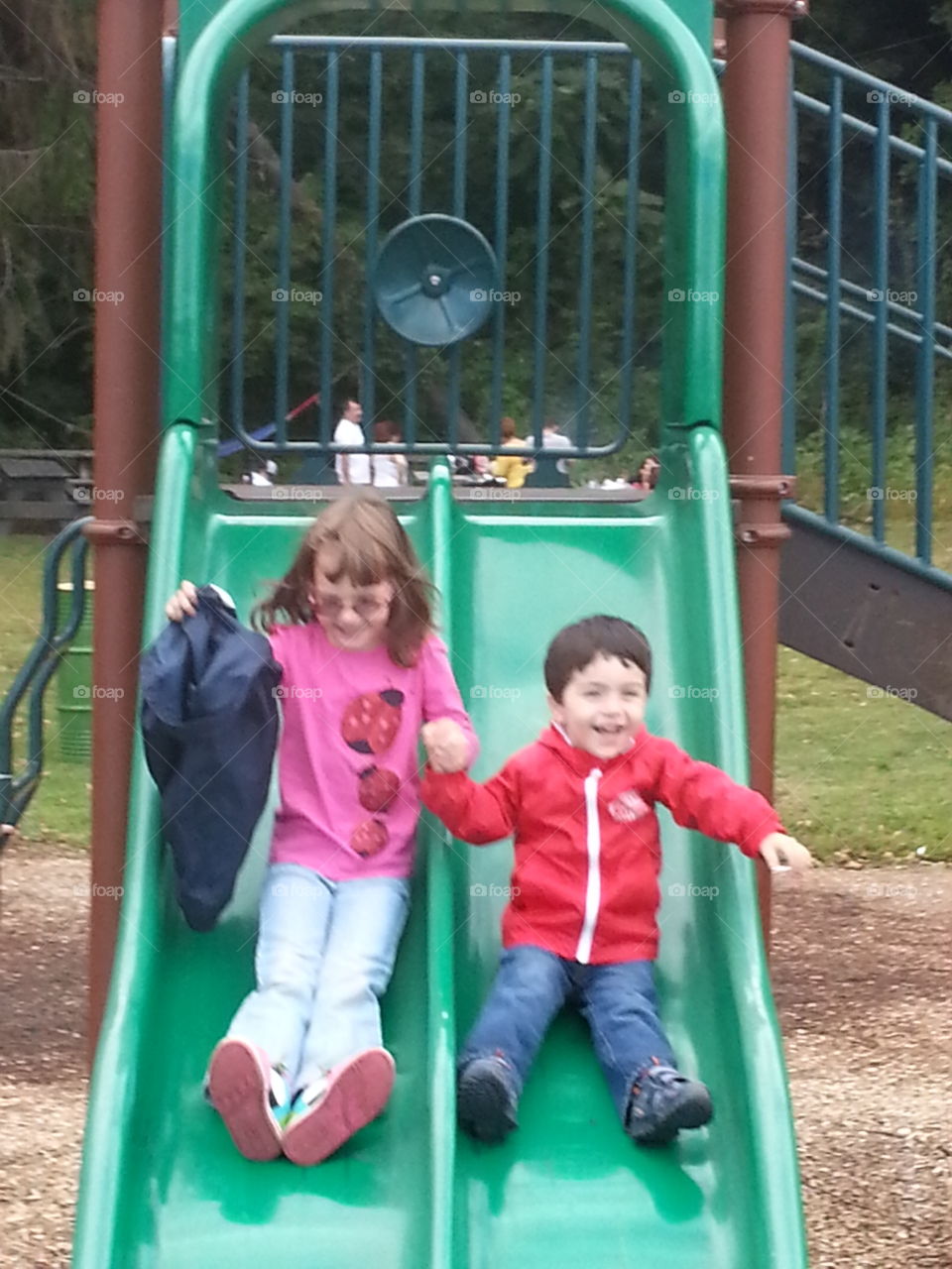 Enjoying a slide together.