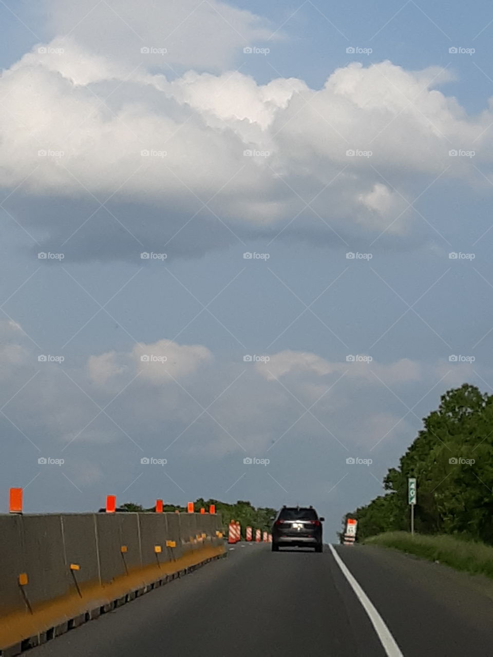 Car Travelling on Road Work Area of Highway