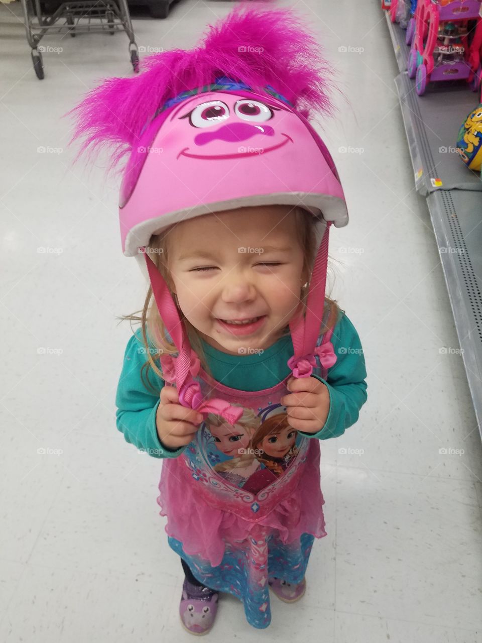 my beautiful daughter loves to ride on anything that moves especially on ATVs. Here she is trying on a helmet in Beaumont