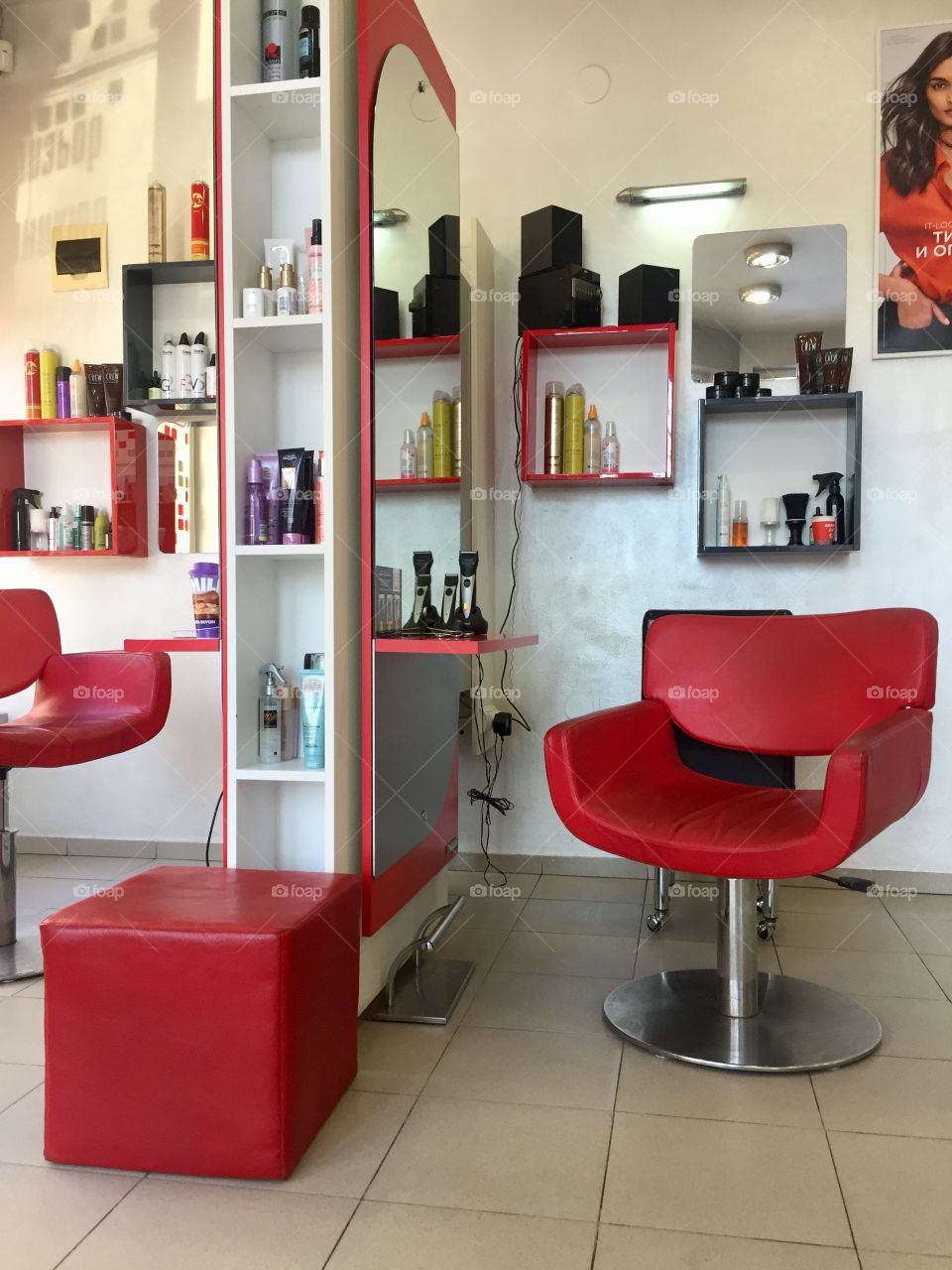Red chairs and interior in hairdressing salon