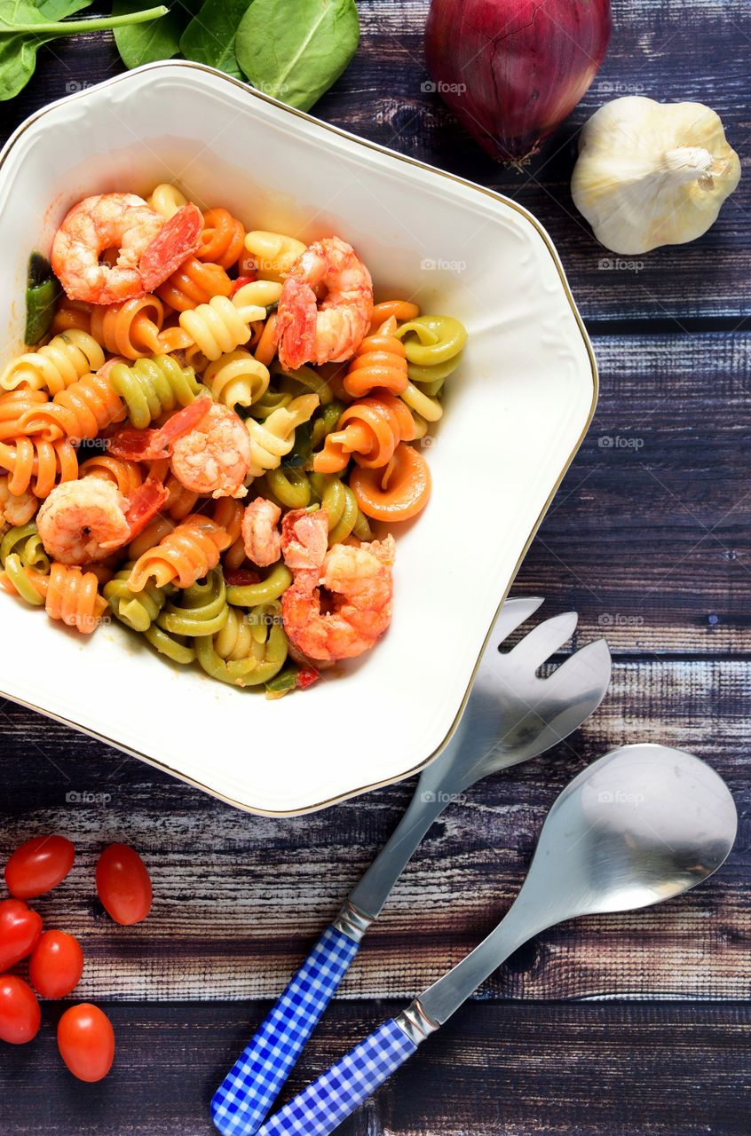 Bowl of tricolor pasta with shrimp