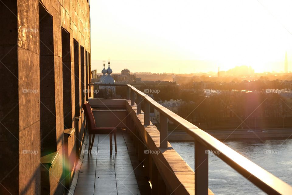 Sunset on the hotel balcony with a view on the river and the cathedral