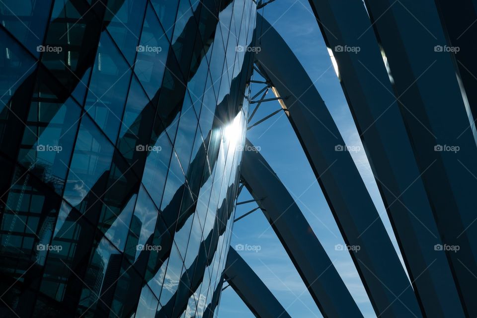 Huge steel column and curtain wall with reflections