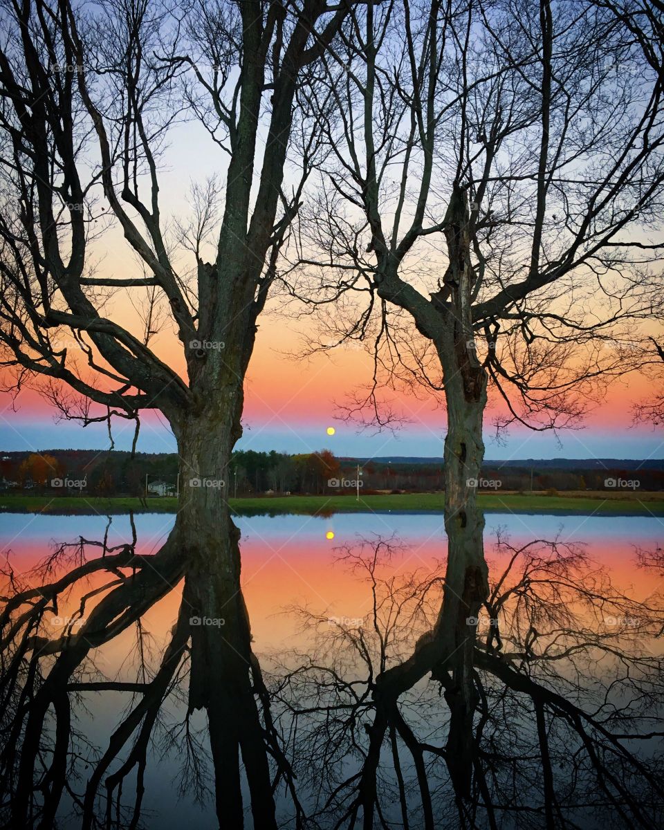 Scenic view of sunset over lake