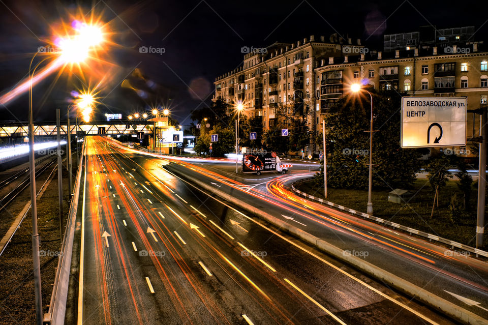 night traffic at summer city embankment