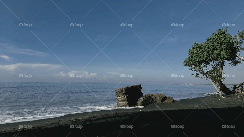 ruins of buildings eroded by beach waves