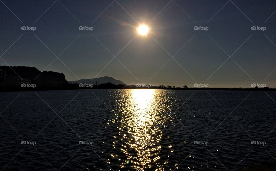 Sun shine on Fusaro lake, Naples, Italy