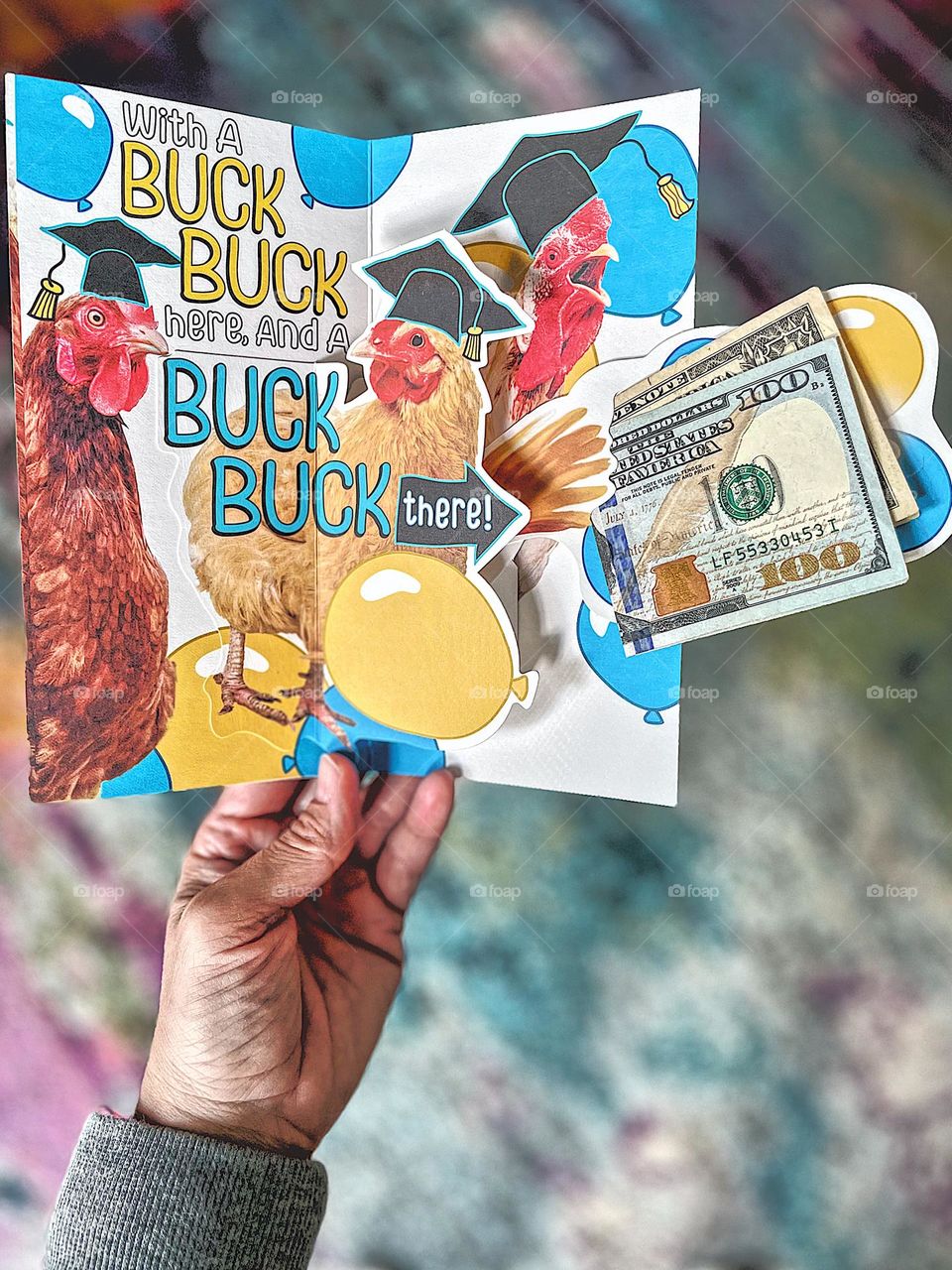 Sending a graduation card with money, making a gift for a high school graduate, Money as a graduation gift, sending a graduation card in the mail, one hundred and one dollars for graduation, Indian culture good luck money