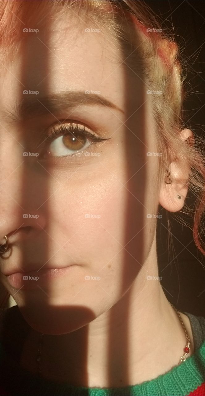 Brown eyes can be beautiful too, especially when against the sunlight shining through the blinds