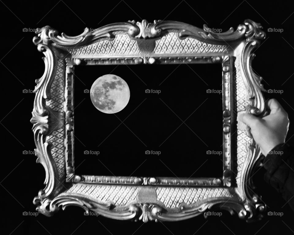 Black and white framed moon photo. 