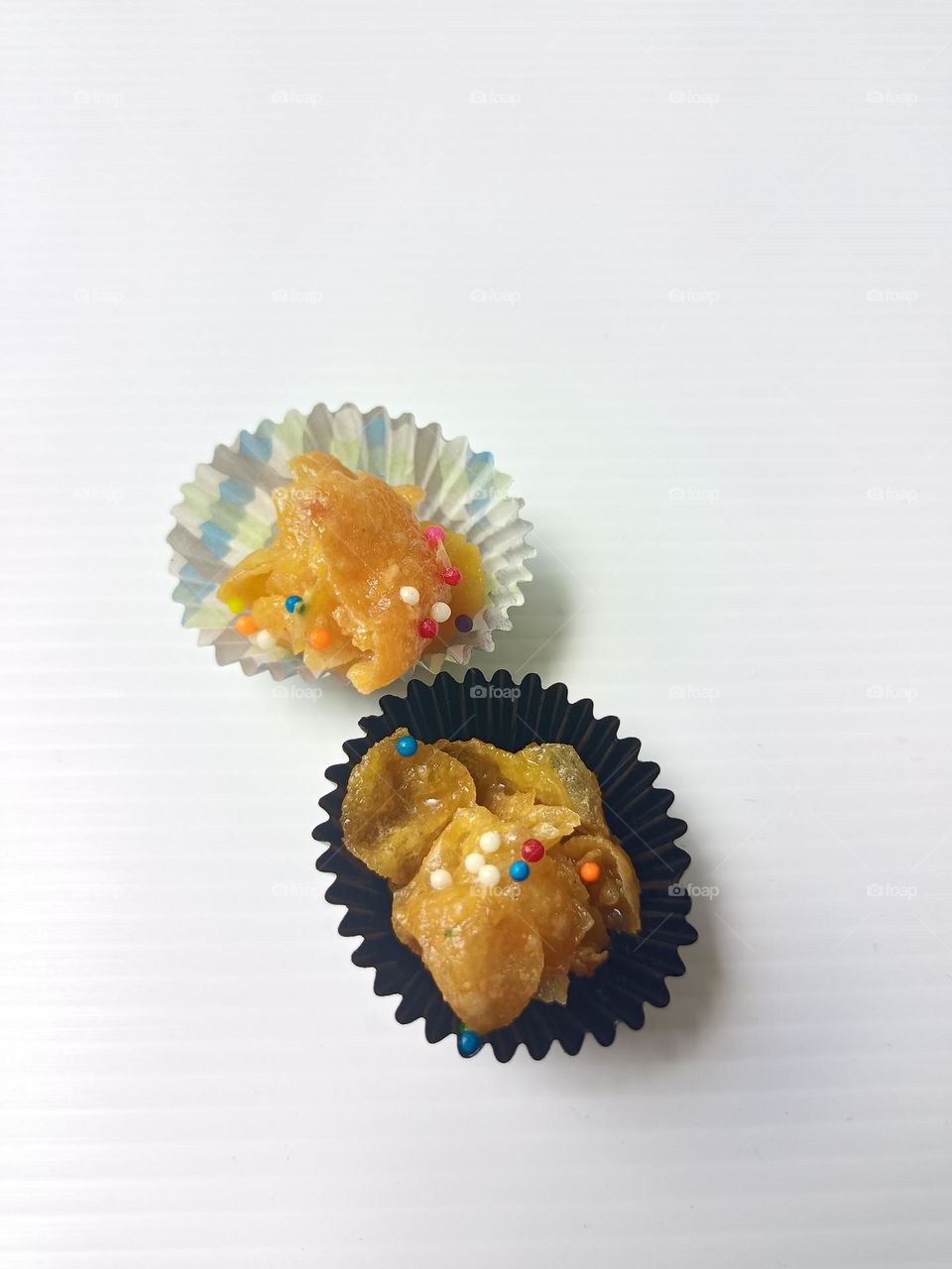 Honey corn flakes cookies on white background.Above close view of honey corn flakes during Hari raya Aidifitri celebrations.HoneyJoys or known as Biskut cornflakes madu photo.