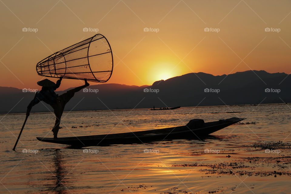Inle lake balancing fishermen at sunset 