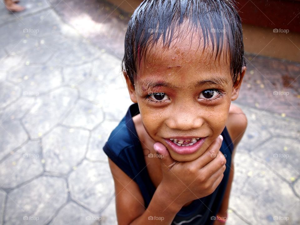 young asian kid smile for the camera