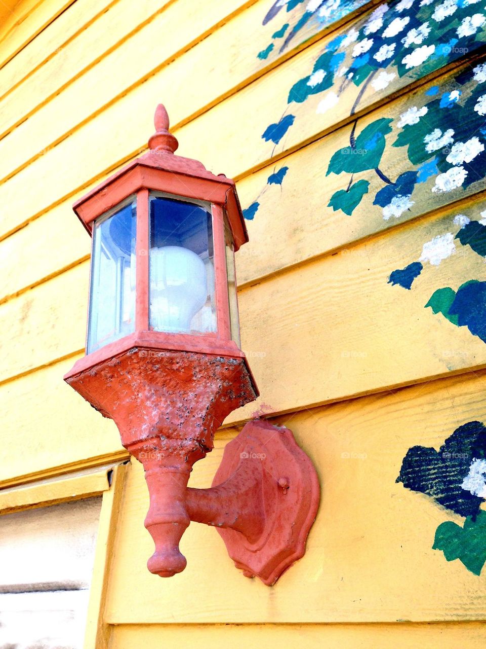 Street art antique lamp and mural.