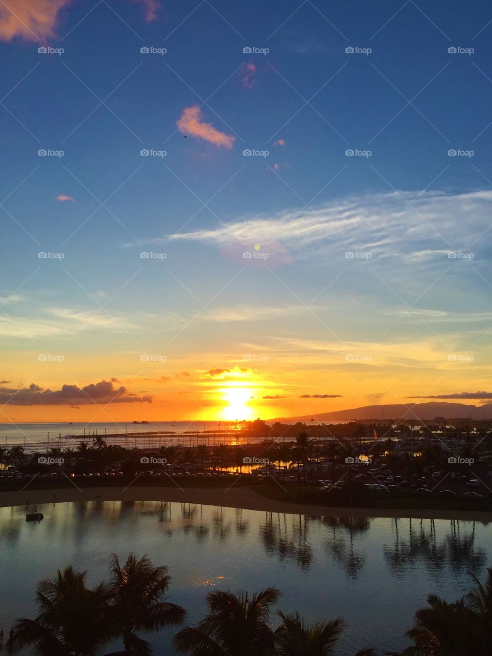 Swimming pool near the sea at sunset