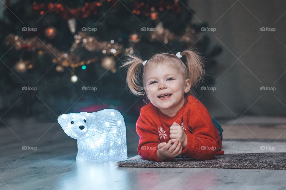 Girl and Christmas tree 