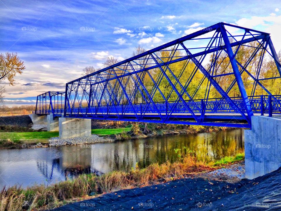 Fall at blue walking bridge. 