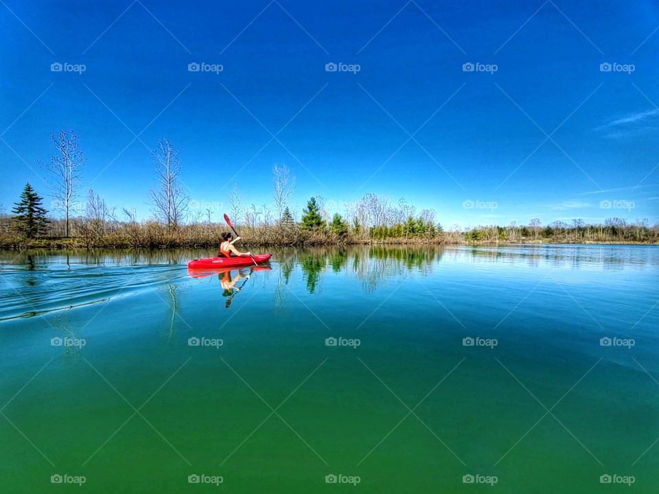 Kayak on green water