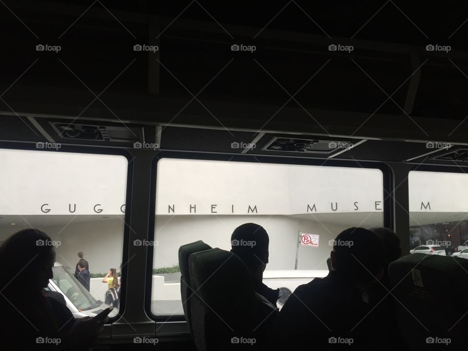 Silhouette of people on a New York bus 