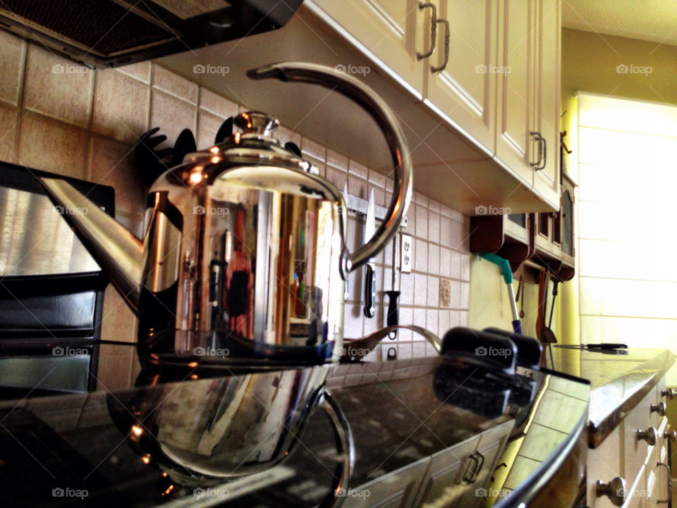 TEAPOT ON STOVE RANGE