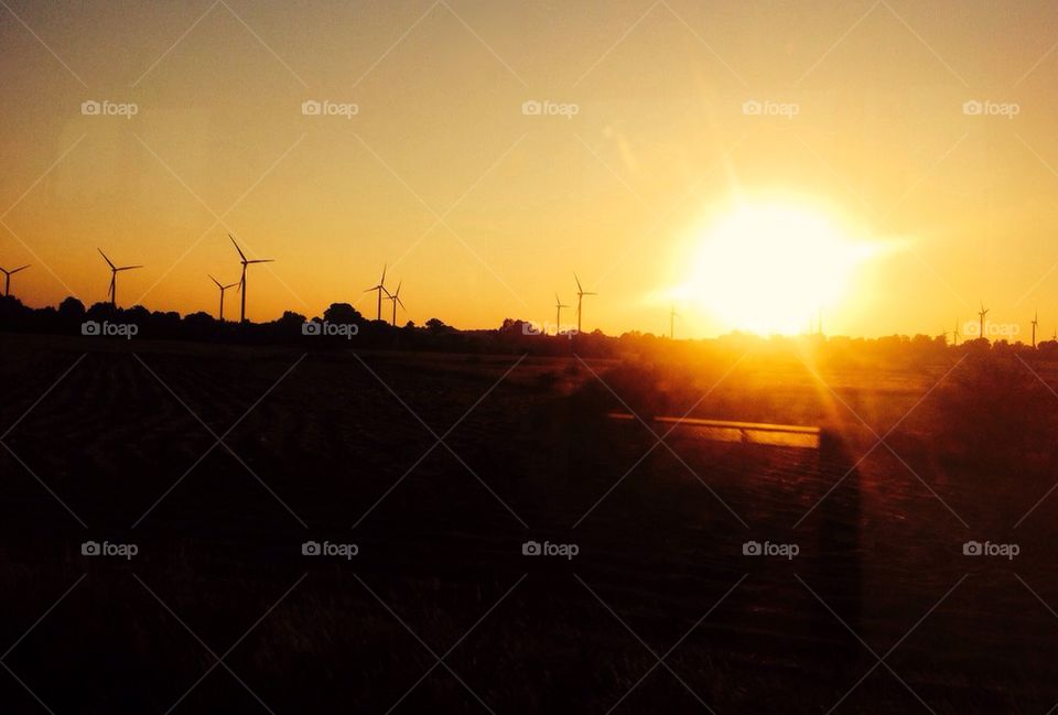 Wind turbines at sunset