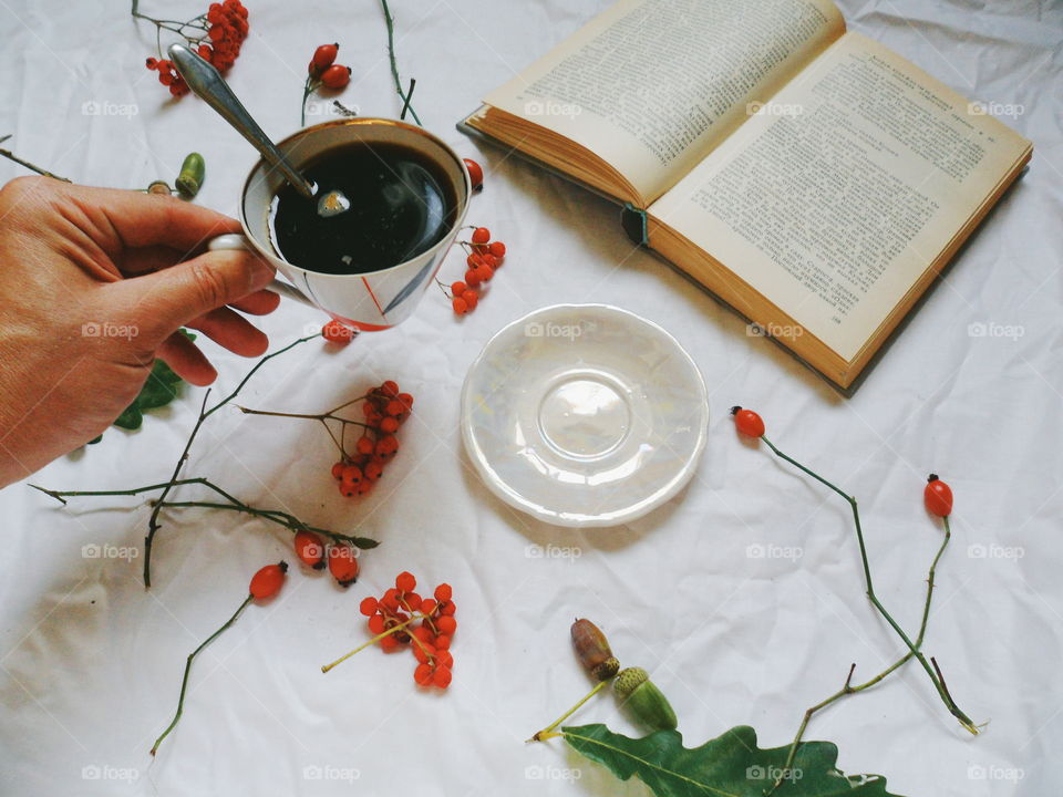 black coffee cup and book