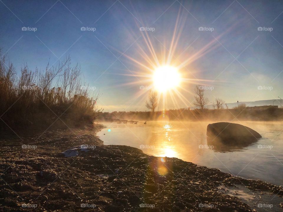Sunrise on the North Platte River in Casper, Wyoming with steam rising from the water