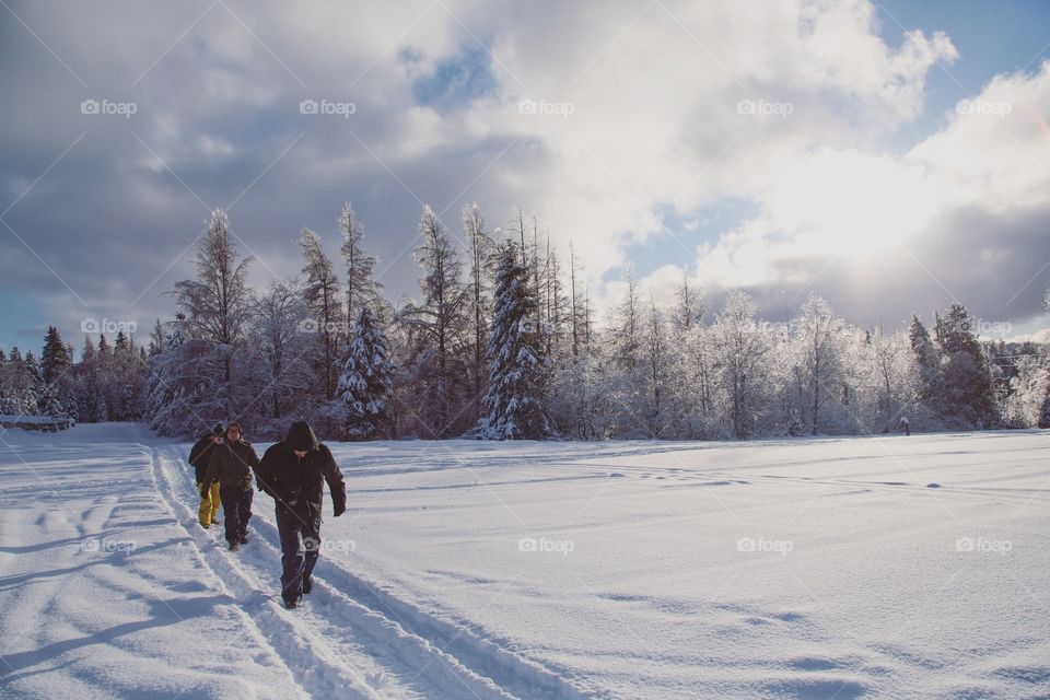 A group of friends walking winter hiking trails