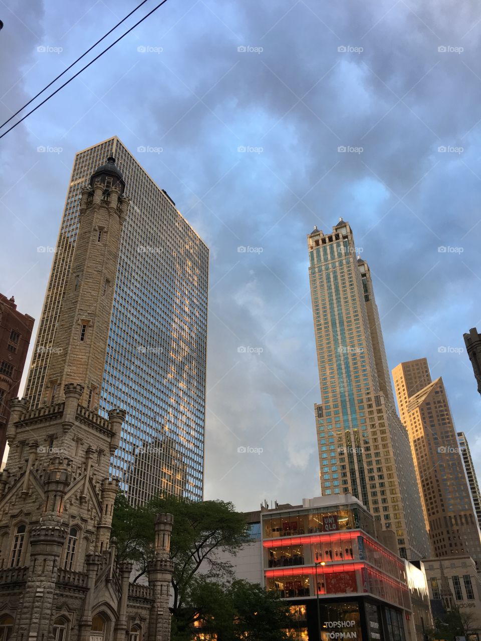 Great Chicago Fire survivor tower on lower left surrounded by urban buildings