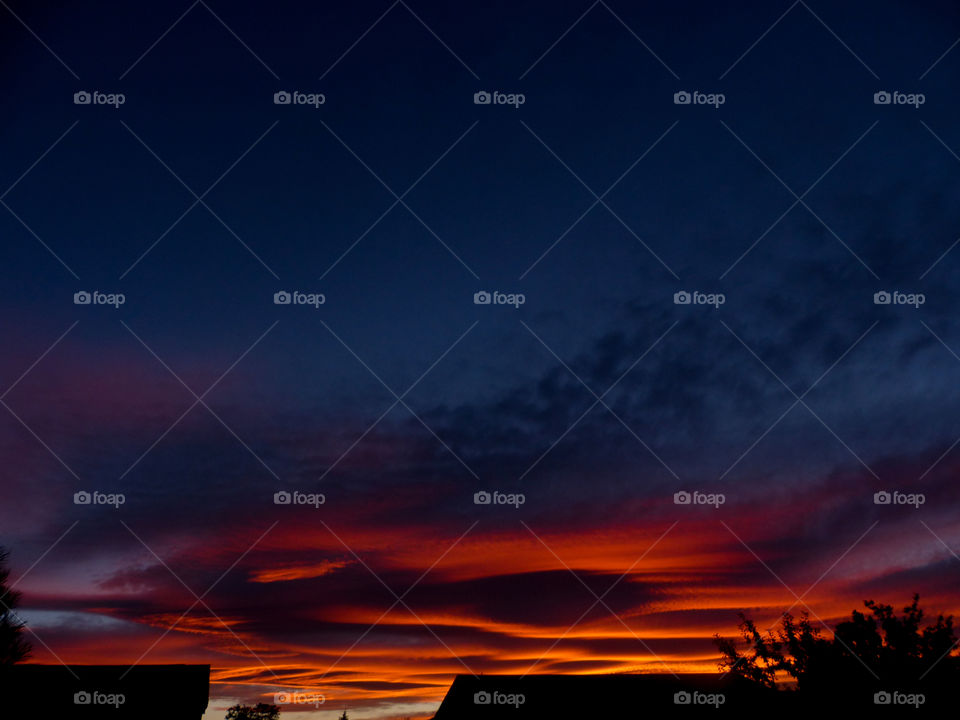 The end of a sunset illuminating the clouds 