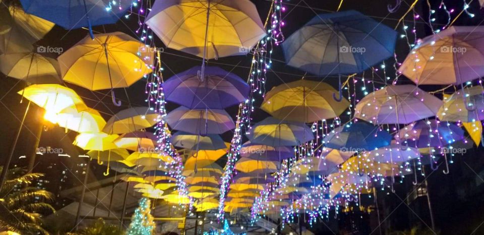 a  stunning colourful ambrela in the middle of the night