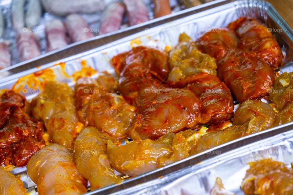 cooking the sausages and meat