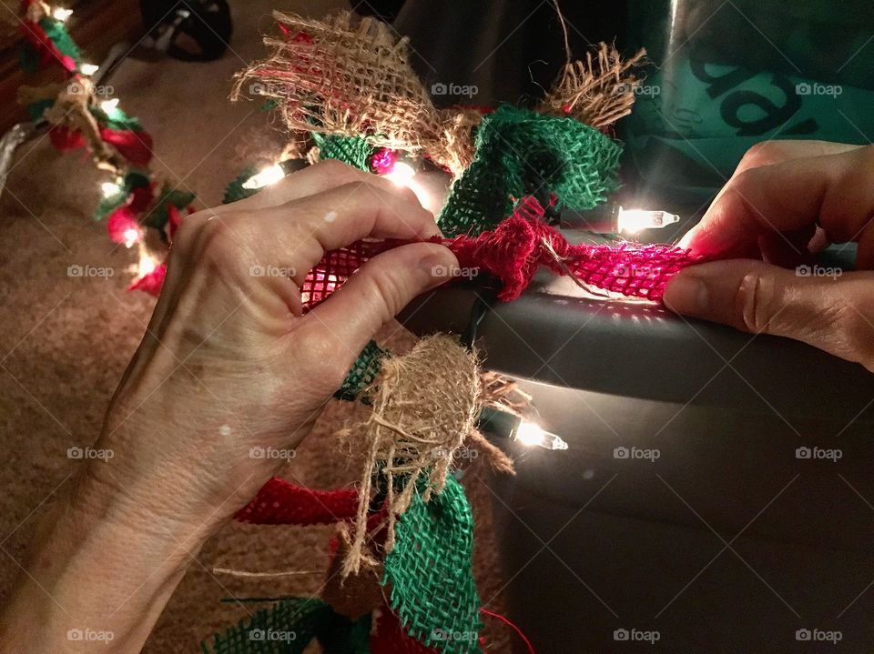 Finishing up the last part of the burlap bows on a string of lights! 