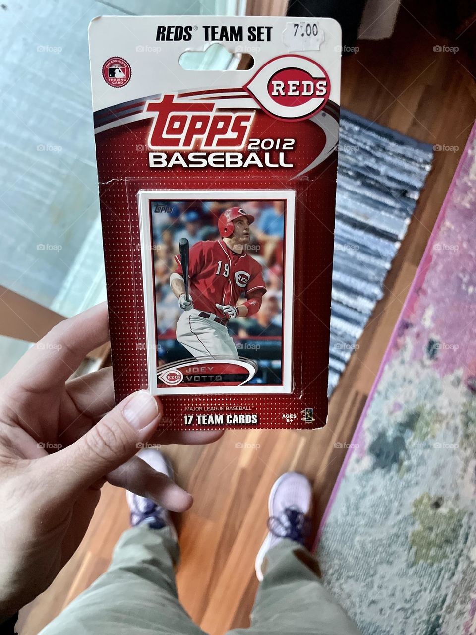 Woman’s hand holding set of baseball cards, 2012 team set of baseball cards, Topps baseball cards team sets, 2012 Reds Baseball Cards team set 