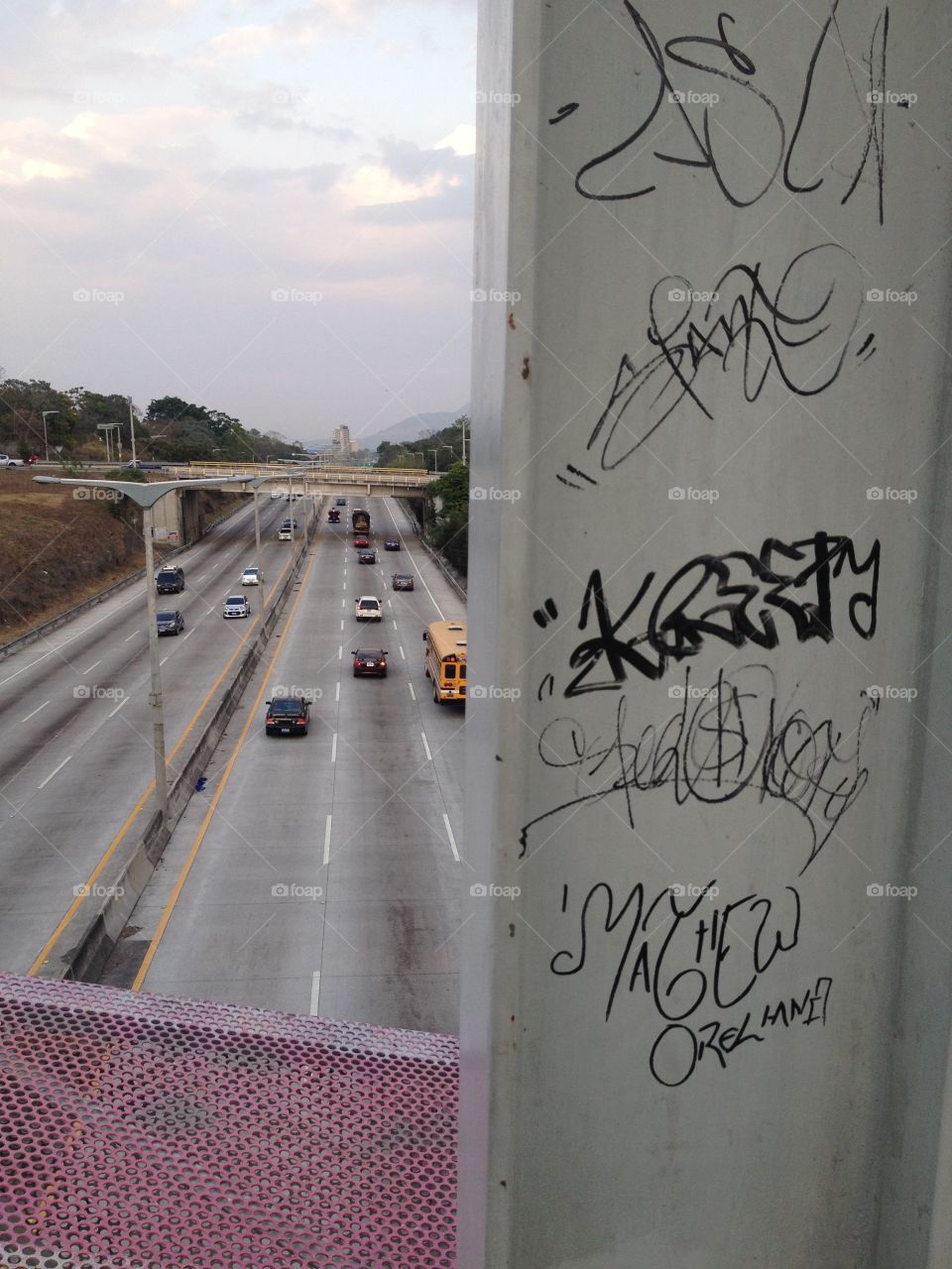 View of cars on road through window