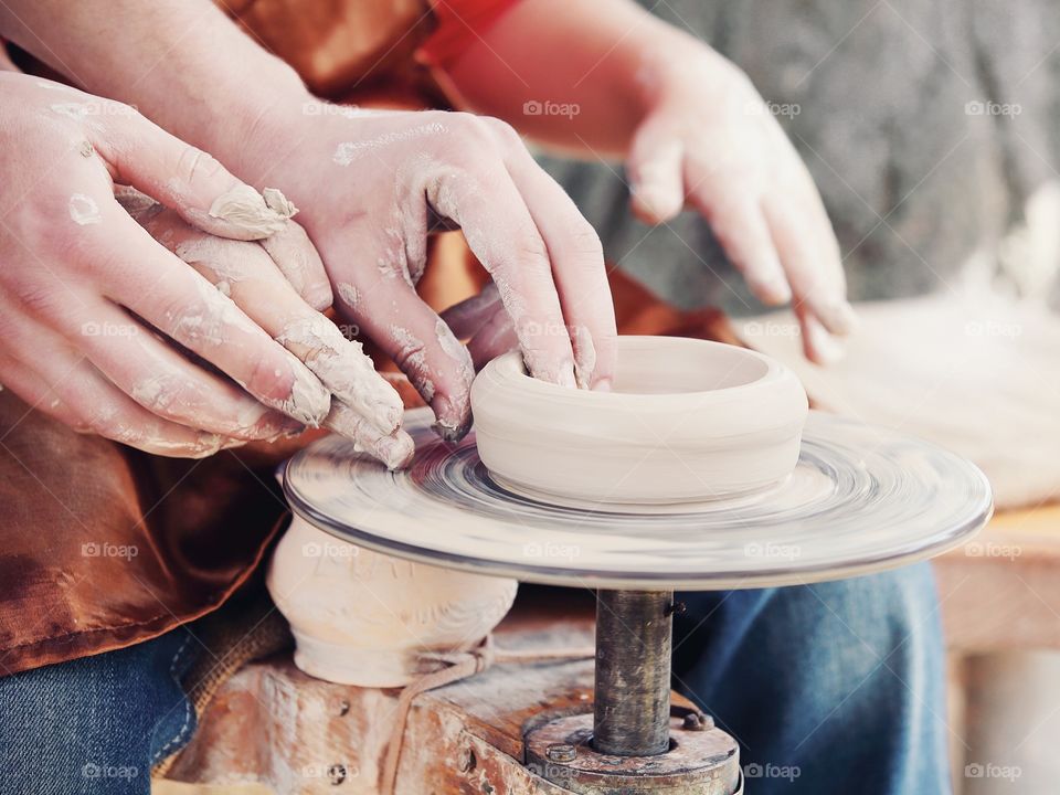 Making clay pottery