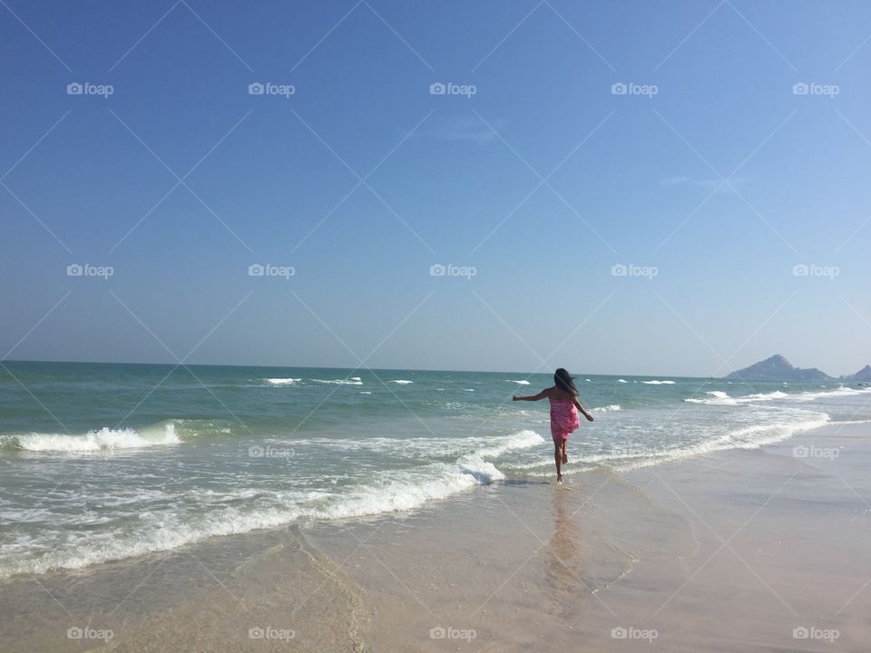 Run Away With Me. A marathon runner just chasing dreams on a beach in Hua Hin, Thailand...