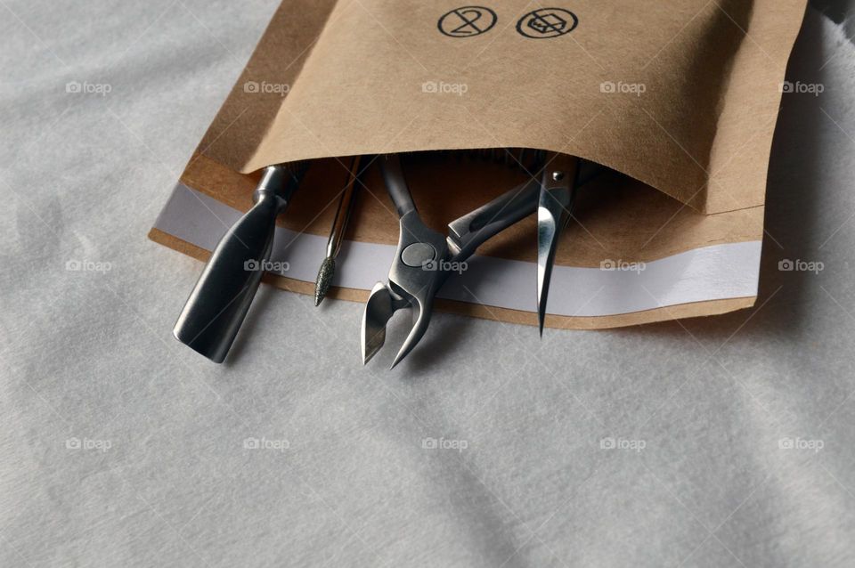 Manicure tools in a kraft bag for sterilization